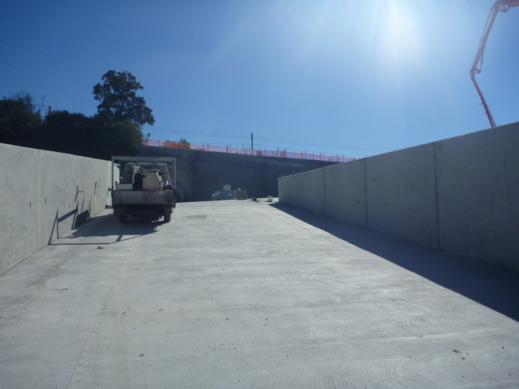 Concrete ramp pavement between retaining walls